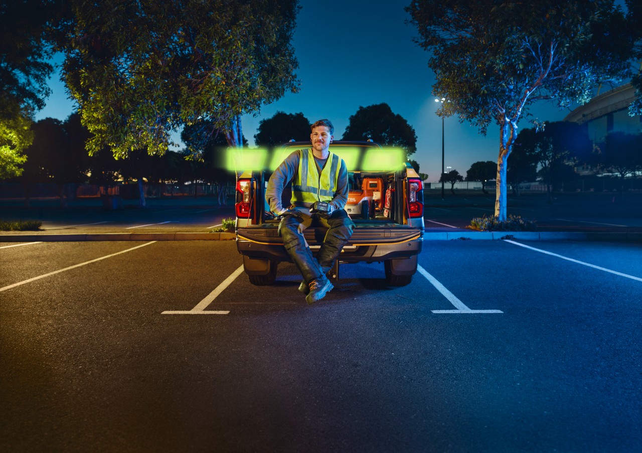 The ALLPRO STIHL AP 300.0 P C in the hands of a professional, sitting on the back of a vehicle.